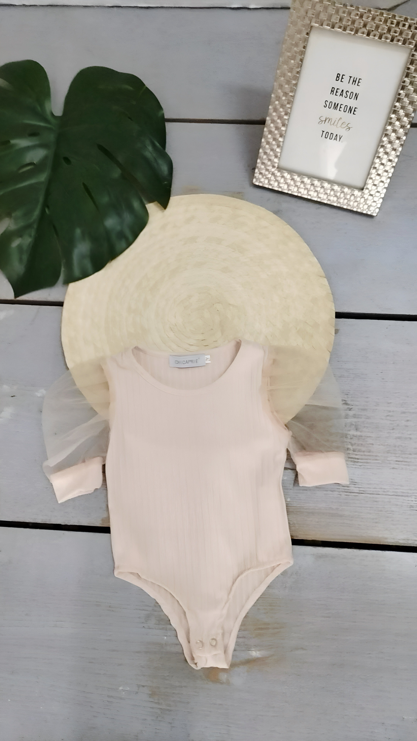 Wholesaler Chicaprie - A girl's lightweight sheer long-sleeved bodysuit with a textured solid color