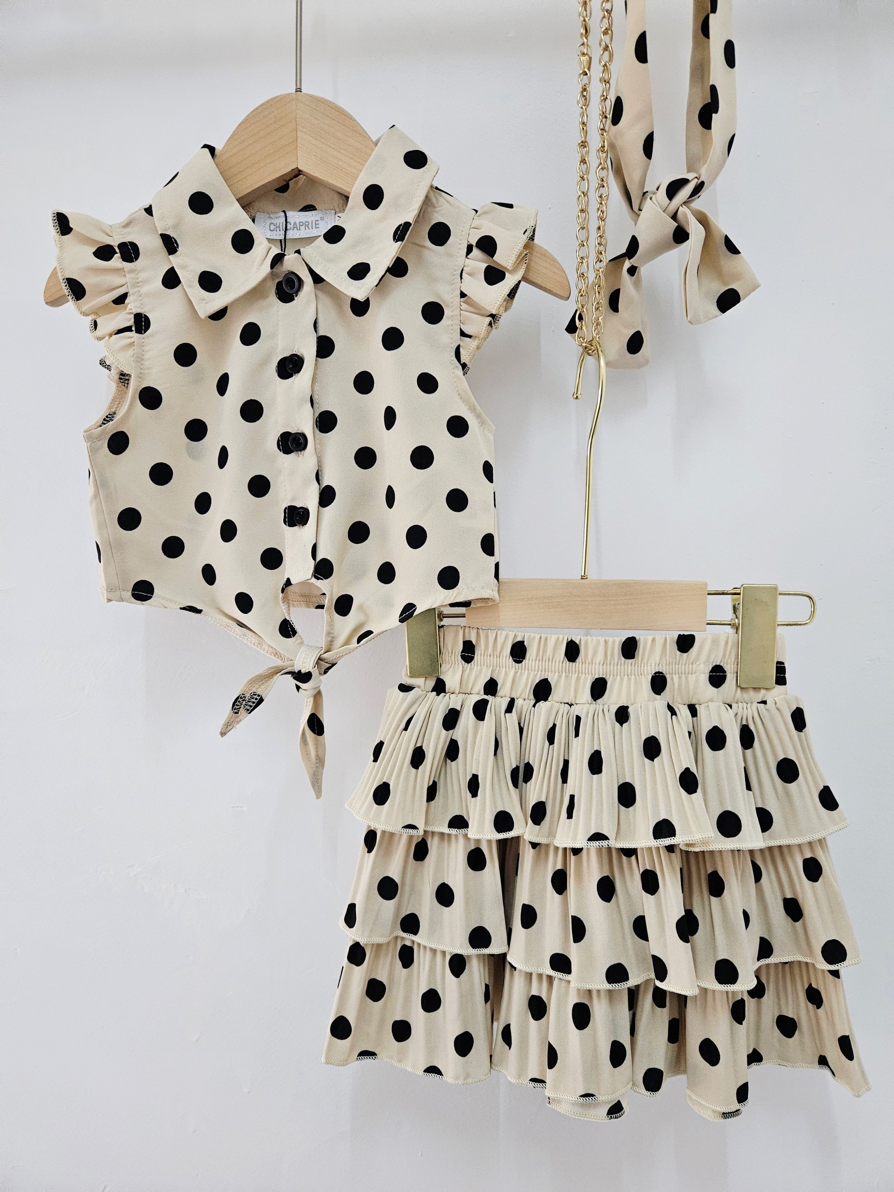 Mayorista Chicaprie - Conjunto para niña con top de nudo y falda corta plisada con volantes de lunares