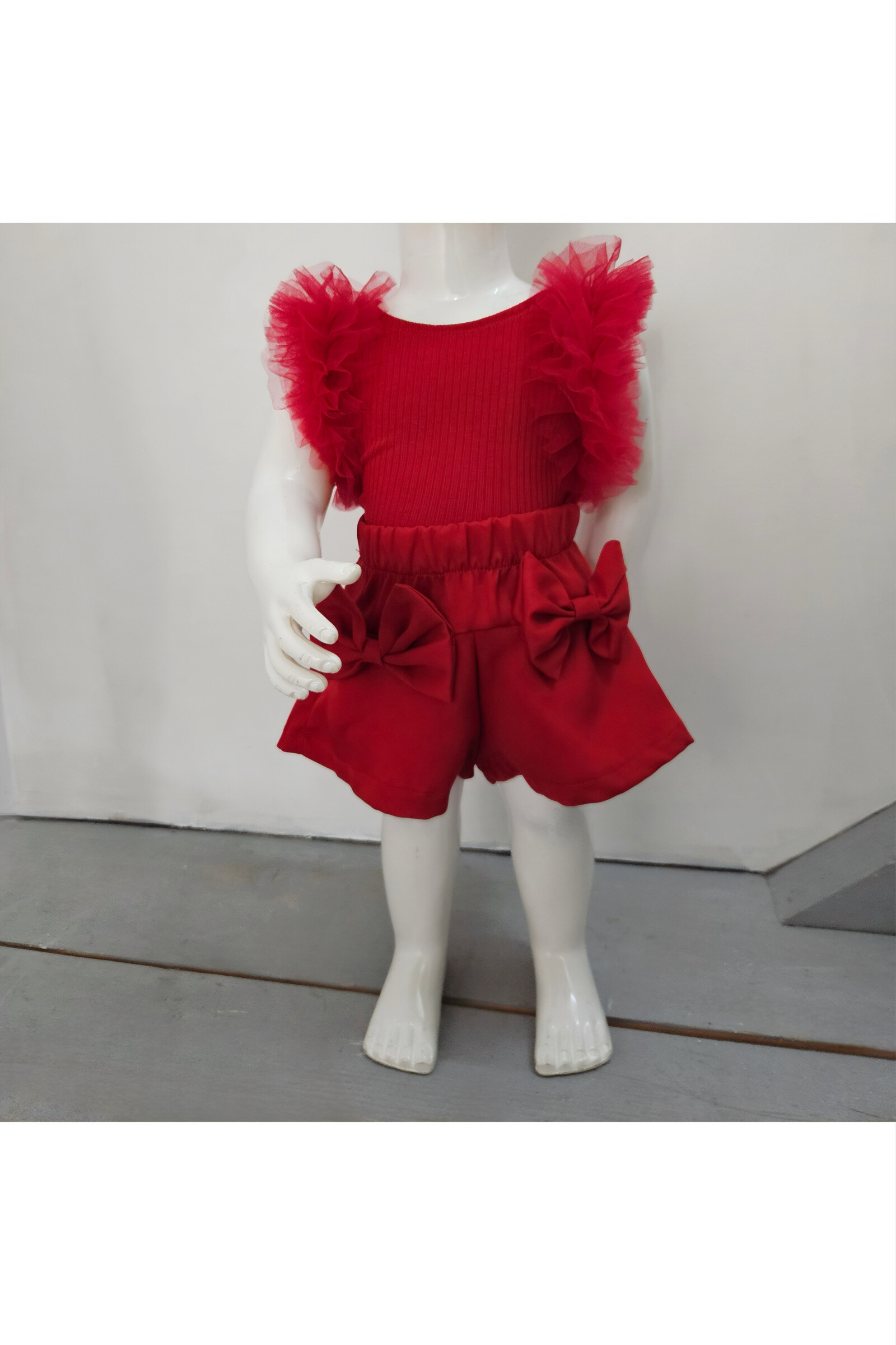 Grossiste Chicaprie - Ensemble Top Finement Côtelé Avec Voilage Epaules Et Short Noeuds Uni Bébé Fille