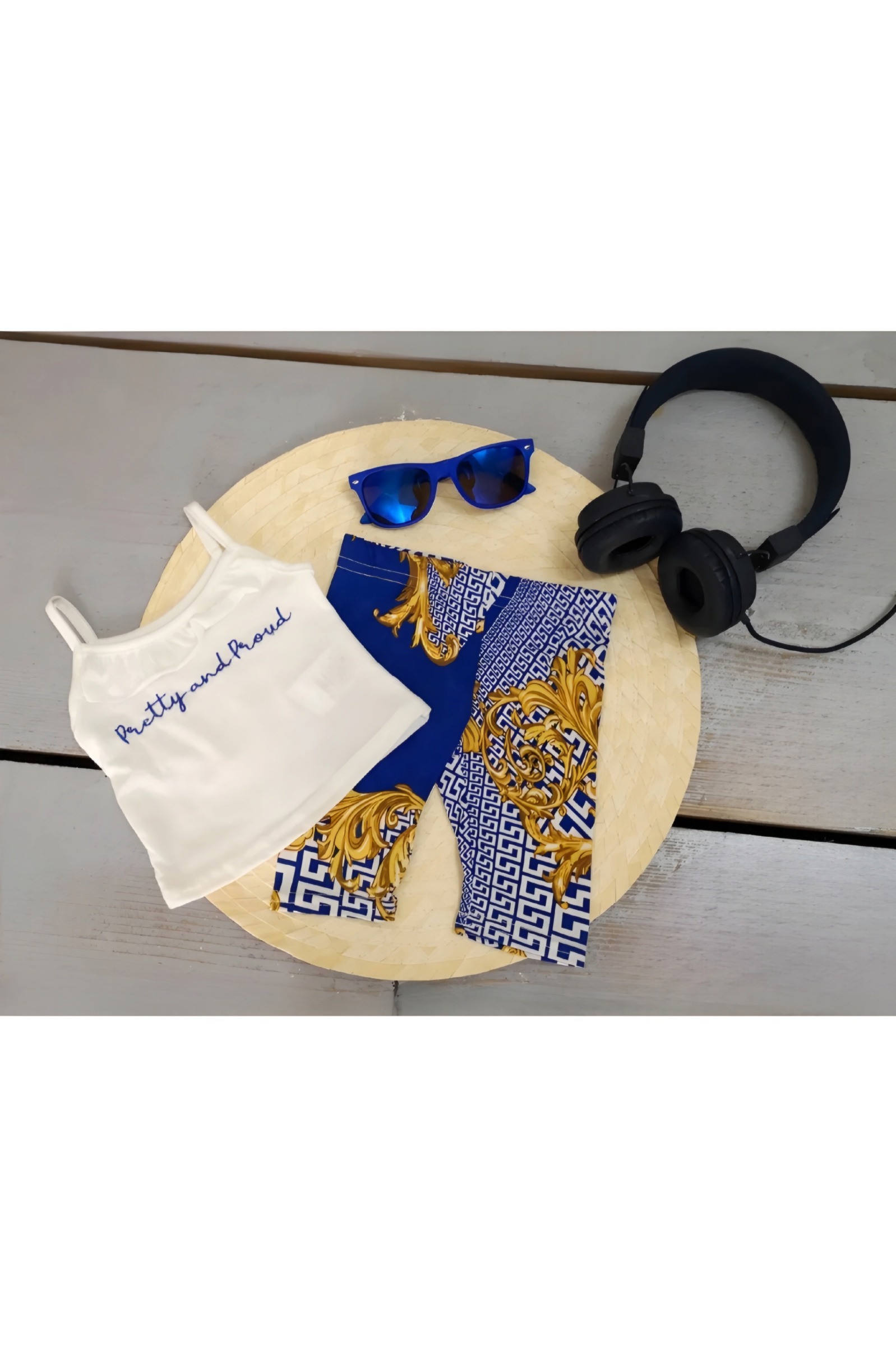 Wholesaler Chicaprie - Chic baby girl set with a plain strap top and chain print leggings