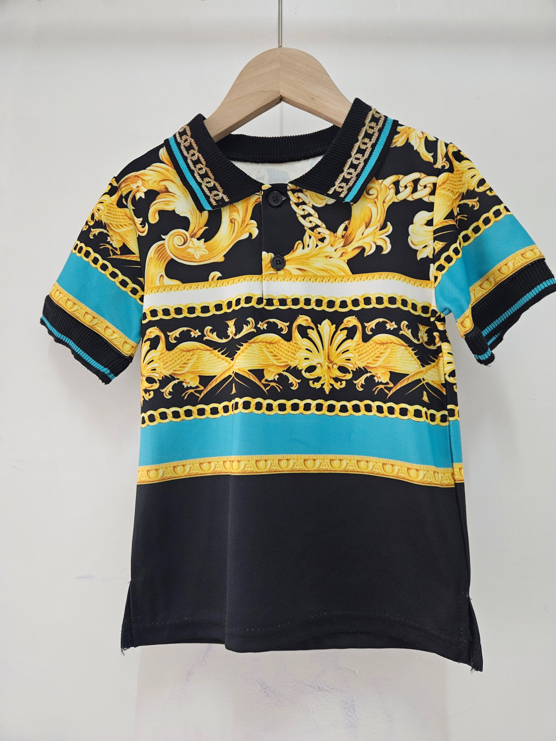 Mayorista Chicaprie - Polo de manga corta para niño con estampado de cadenas doradas y rayas elegantes