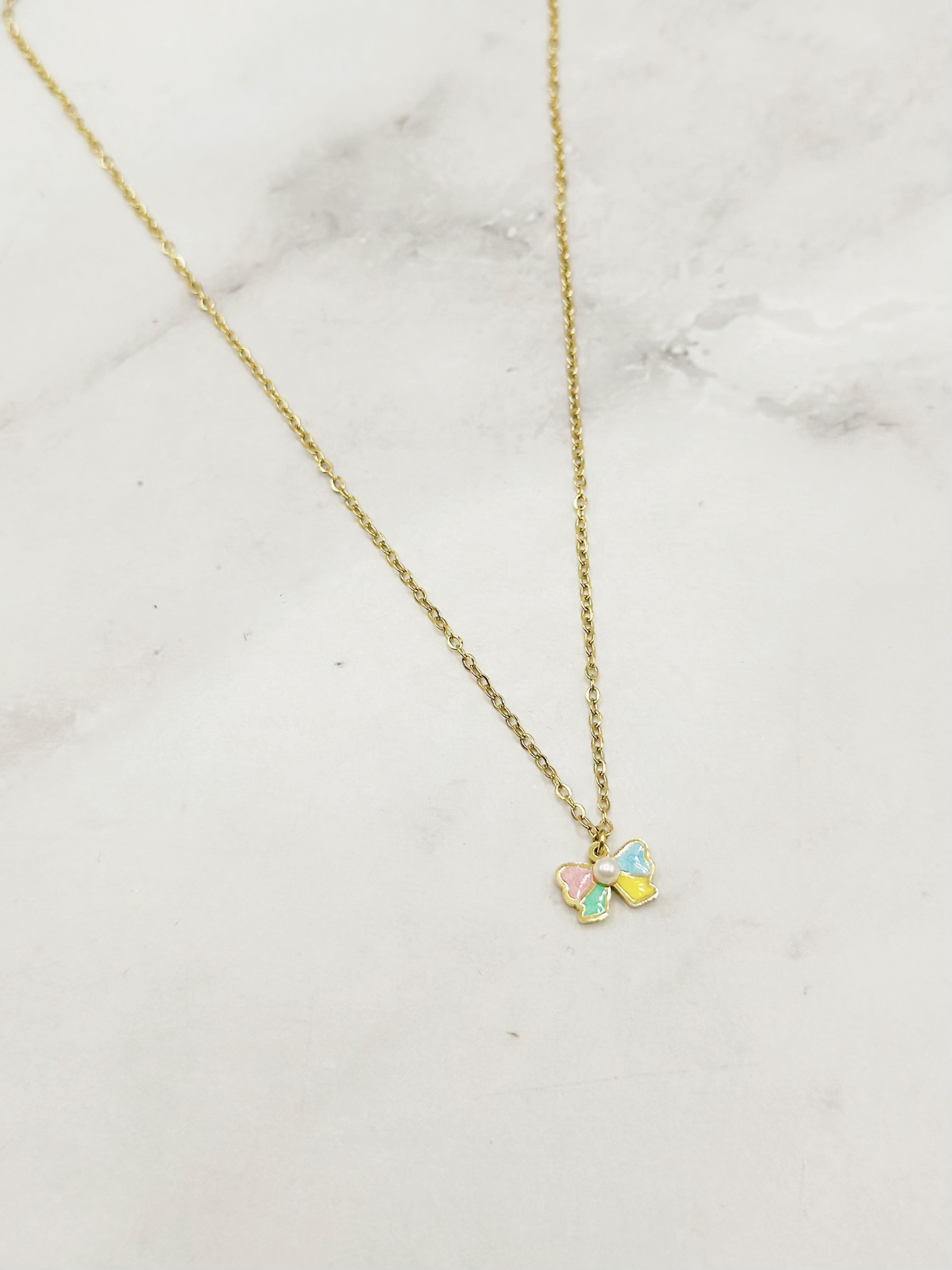 Wholesaler Emily - Children's necklace in gold-plated stainless steel with multicolored enamel bow