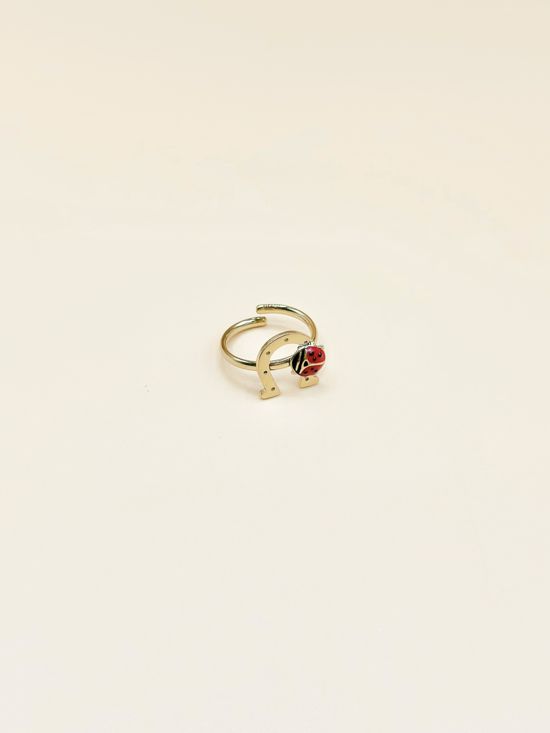 Grossiste Emily - Bague ajustable enfant en acier inoxydable doré Fer à cheval coccinelle