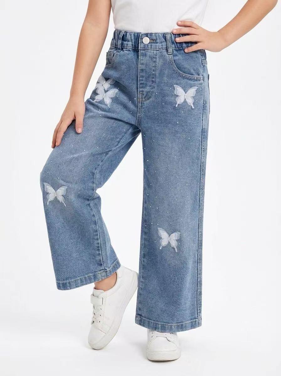 Mayorista Fiona & Co - Vaqueros azules anchos para niña con detalles de strass y mariposas