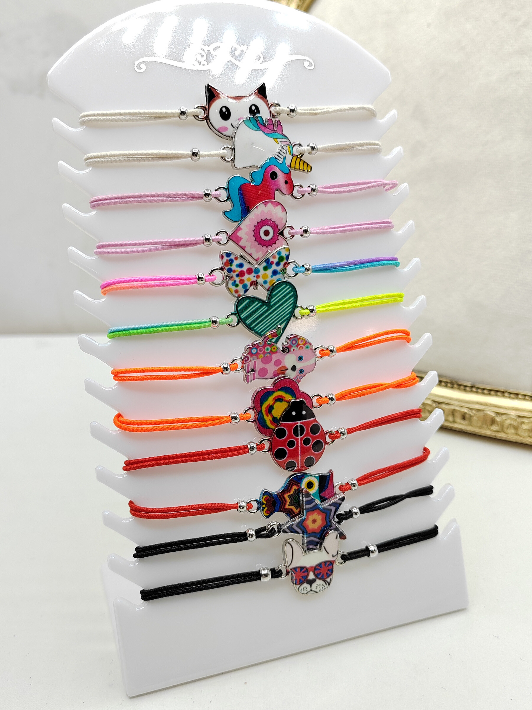 Grossiste I.L JOLI B - Plaquette de 12 bracelets élastique pour enfant