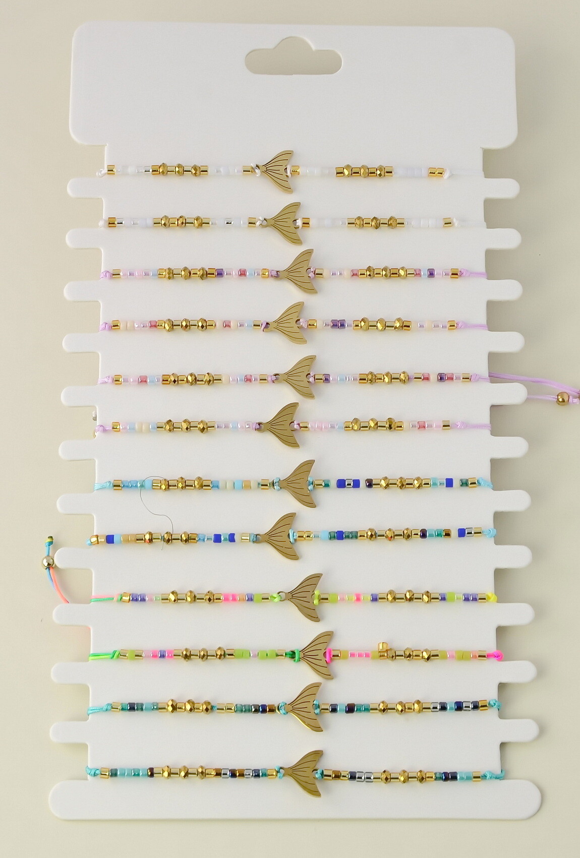 Wholesaler LILY CONTI - Set of 12 adjustable bracelets in gold stainless steel and seed beads