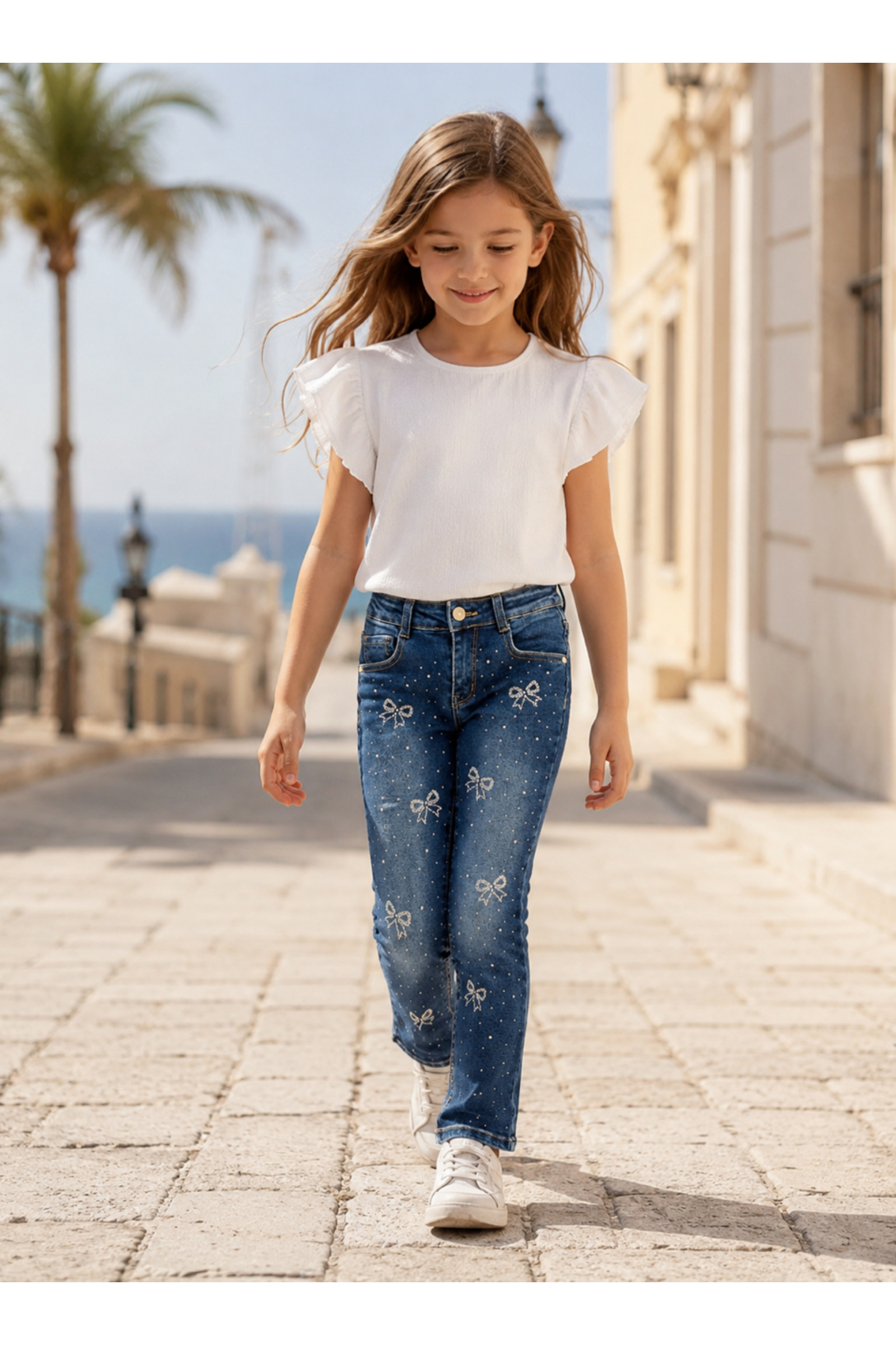 Wholesaler Squared & Cubed - Girls' flared jeans with bow-shaped rhinestones