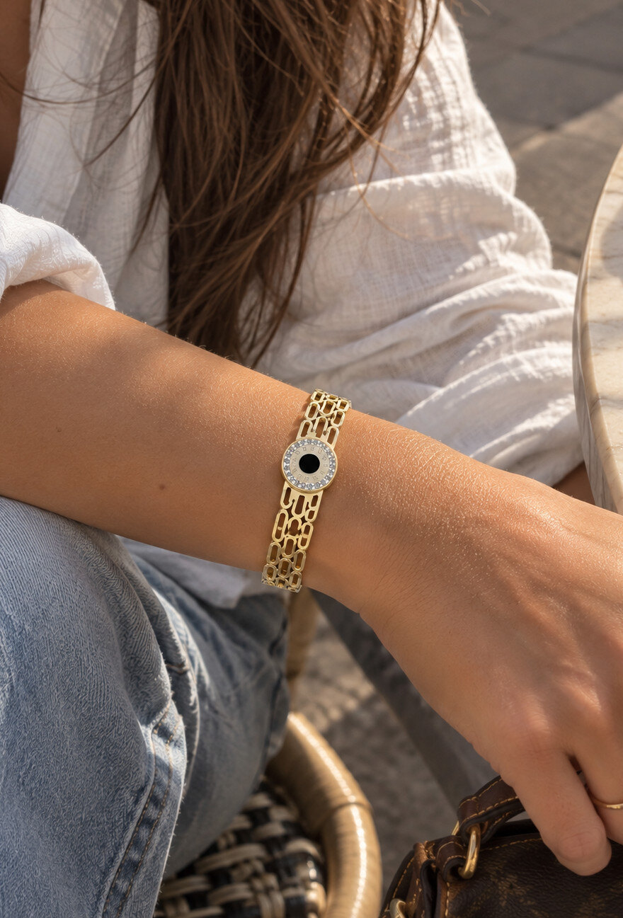 Mayorista Aliya Bijoux - Brazalete rígido con un ojo negro en el centro.
