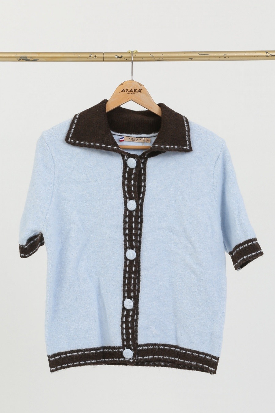 Pull femme léger, idéal pour l'été, en polyamide, viscose et laine, douceur enrichie de plumes d'autruche, fabriqué en Chine.