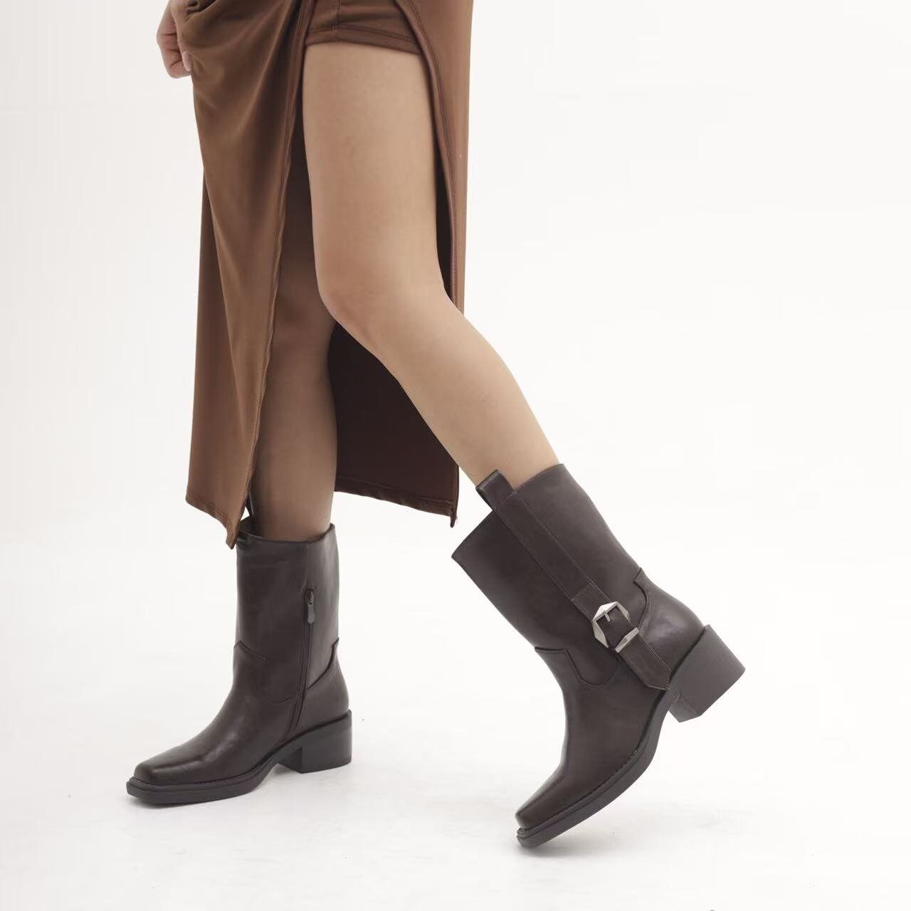 Wholesaler BEAVITA SHOES - Black mid-calf leather boots with a chunky heel, side buckle, and square toe.