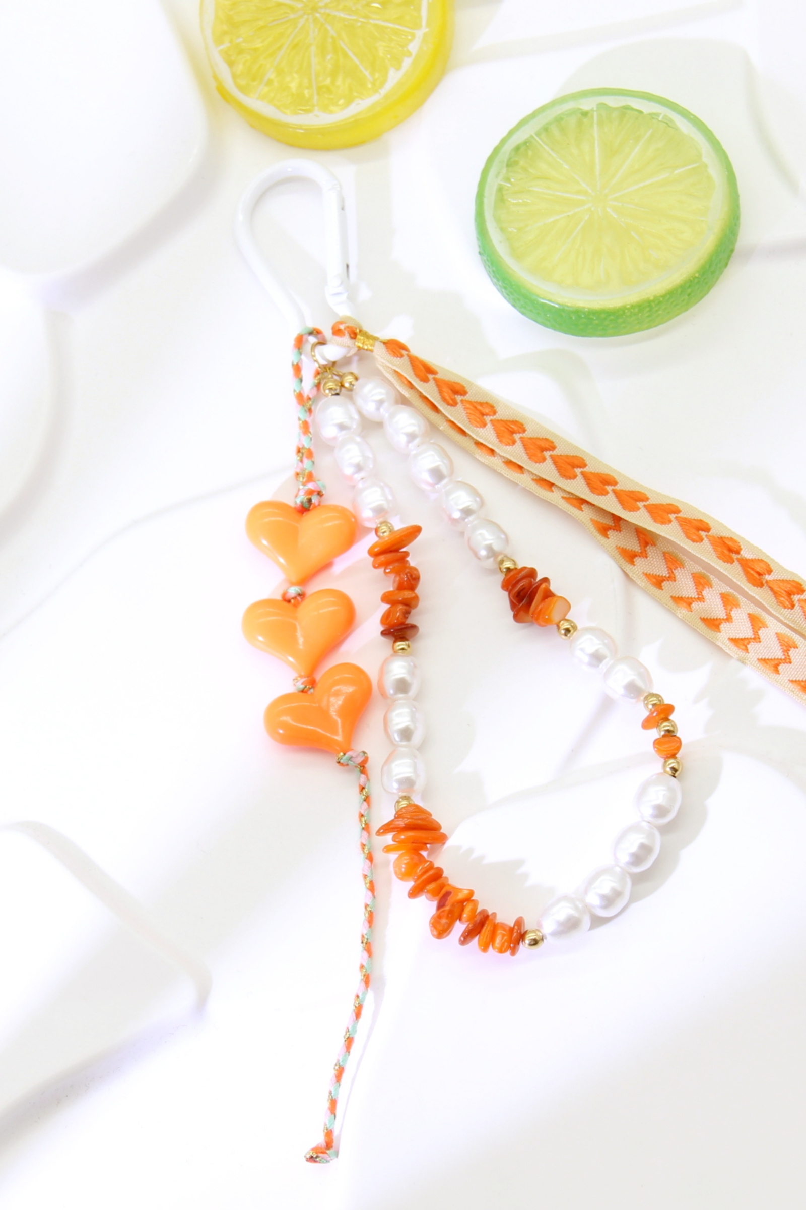 Grossiste Bellissima - Grigri de Sac Cœur Orange / Porte-Clé – Perles & Ruban Tendance