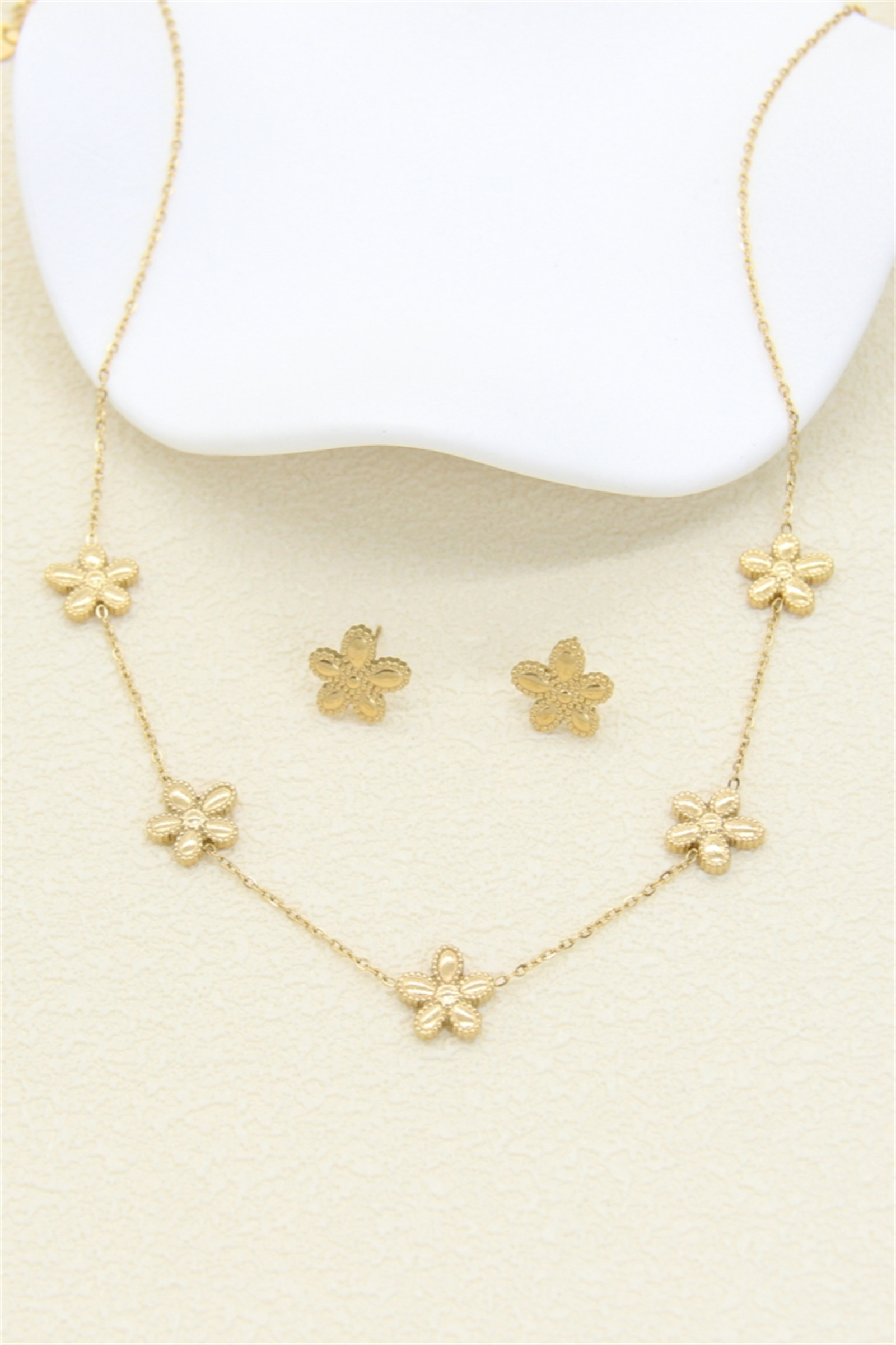 Grossiste Bellissima - Parure fleur dorée – acier inoxydable