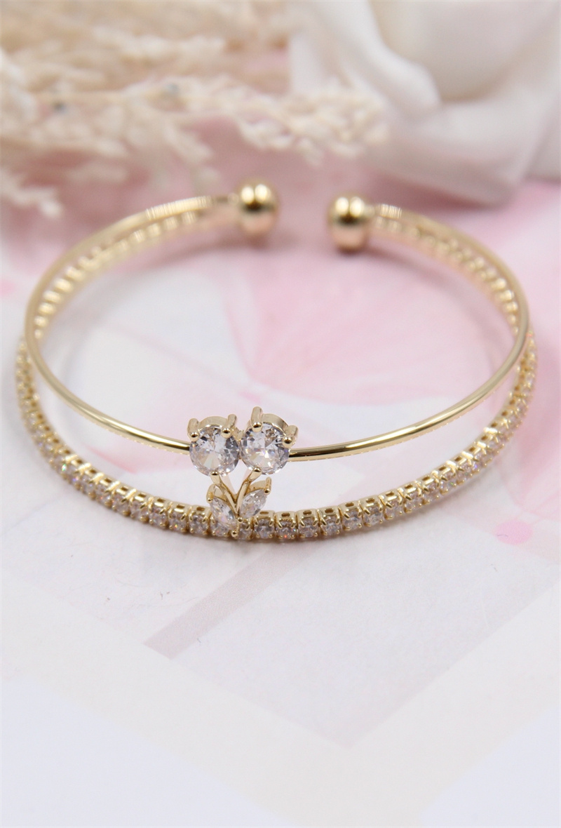Grossista Bellissima - Bracciale floreale regolabile e rodinato, impreziosito da zirconi
