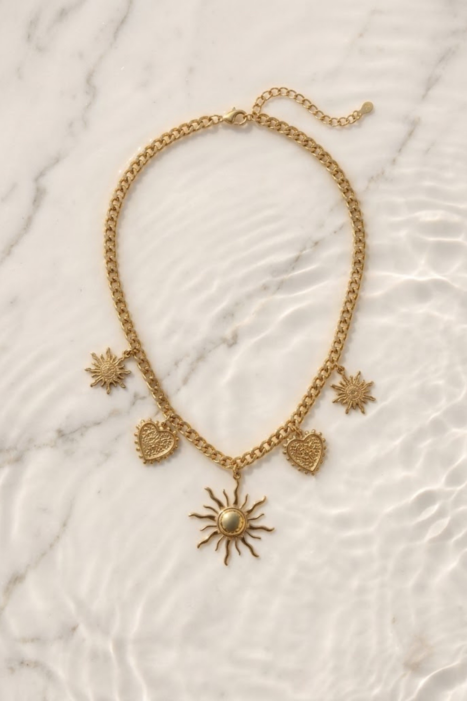 Grossiste Bellissima - Collier soleil & cœur en acier inoxydable doré