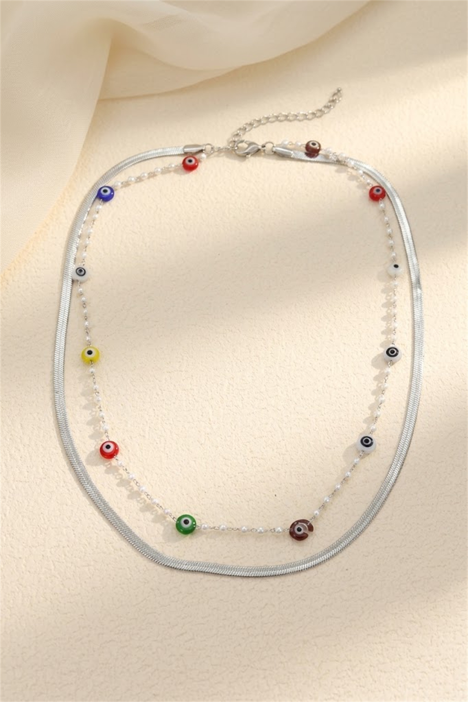 Wholesaler Bellissima - Double-layer necklace with eye motifs in stainless steel