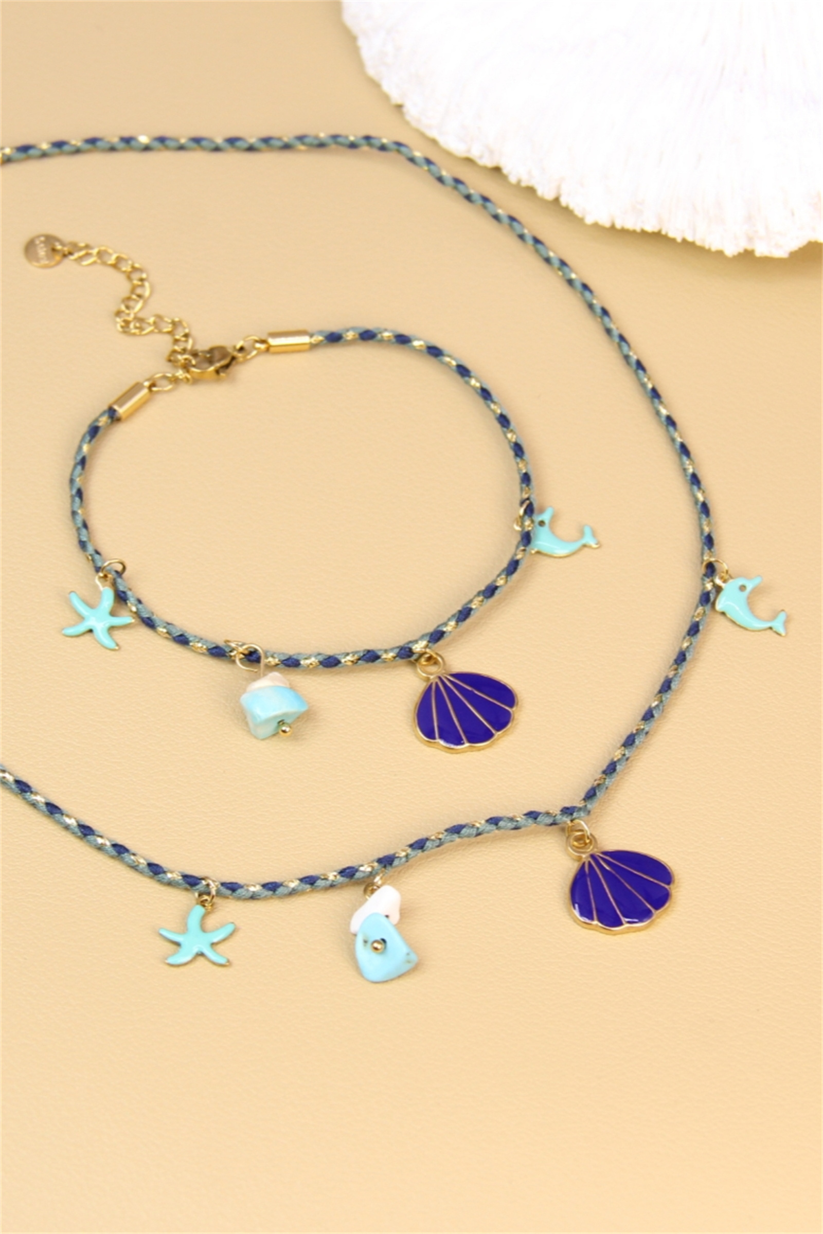 Grossista Bellissima - Set estivo cordino intrecciato blu - Collana e bracciale con ciondoli a conchiglia, stella marina, delfino