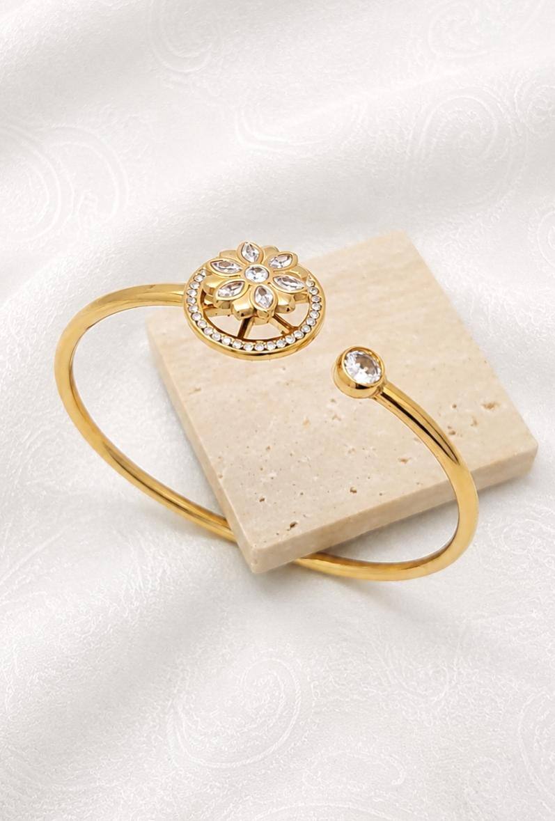 Wholesaler Bijoussimo - Women's gold-plated steel bracelet with rotating flower design