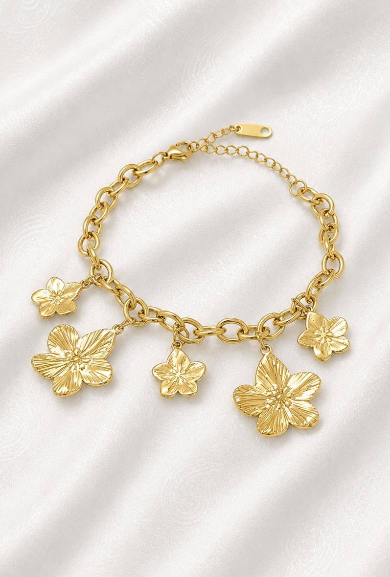 Mayorista Bijoussimo - Pulsera de acero dorado para mujer con colgantes de flores de hibisco