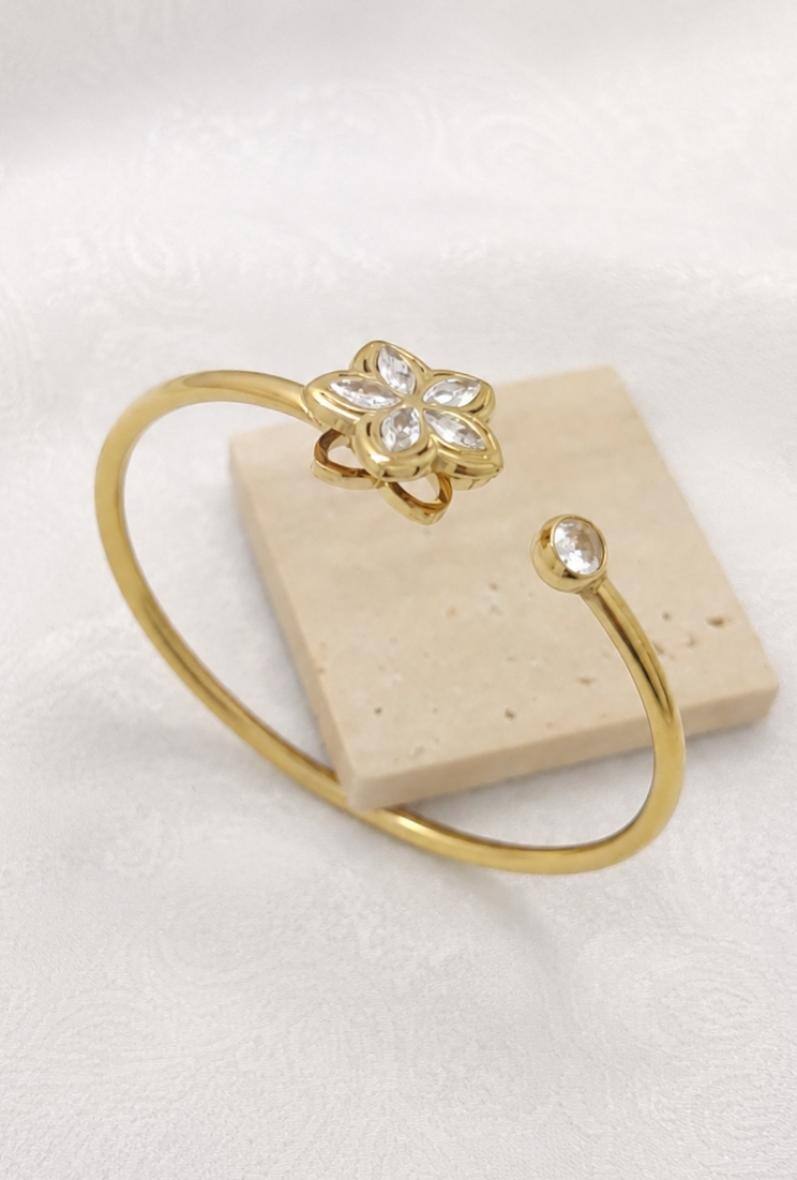 Grossiste Bijoussimo - Bracelet acier doré femme, motif rotatif fleur 5 pétales