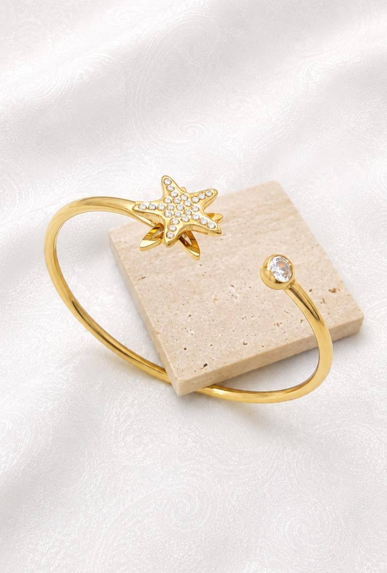 Wholesaler Bijoussimo - Women's gold-plated steel bracelet with rotating star design