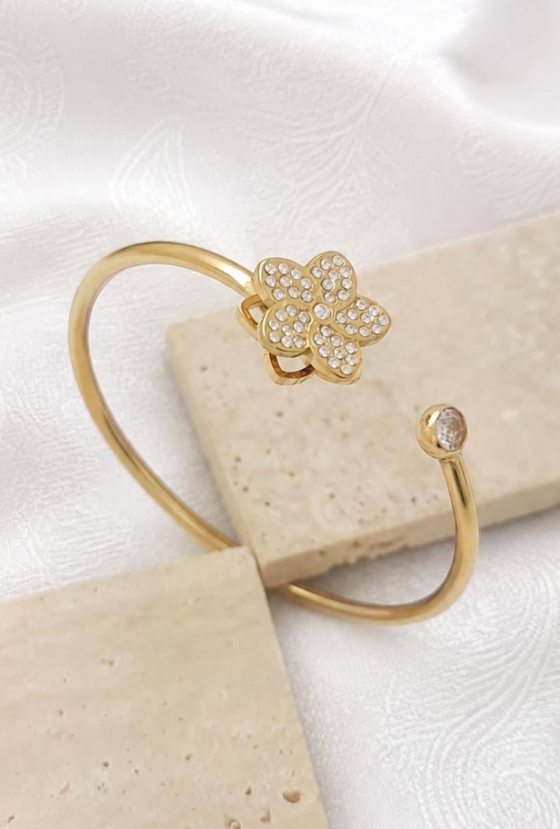 Wholesaler Bijoussimo - Women's gold-plated steel bracelet, rotating flower design
