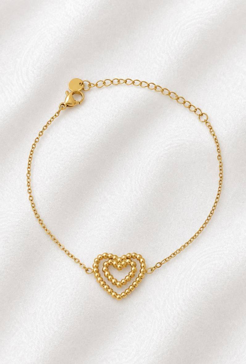 Grossista Bijoussimo - Bracciale in acciaio dorato da donna, cuori doppi intrecciati