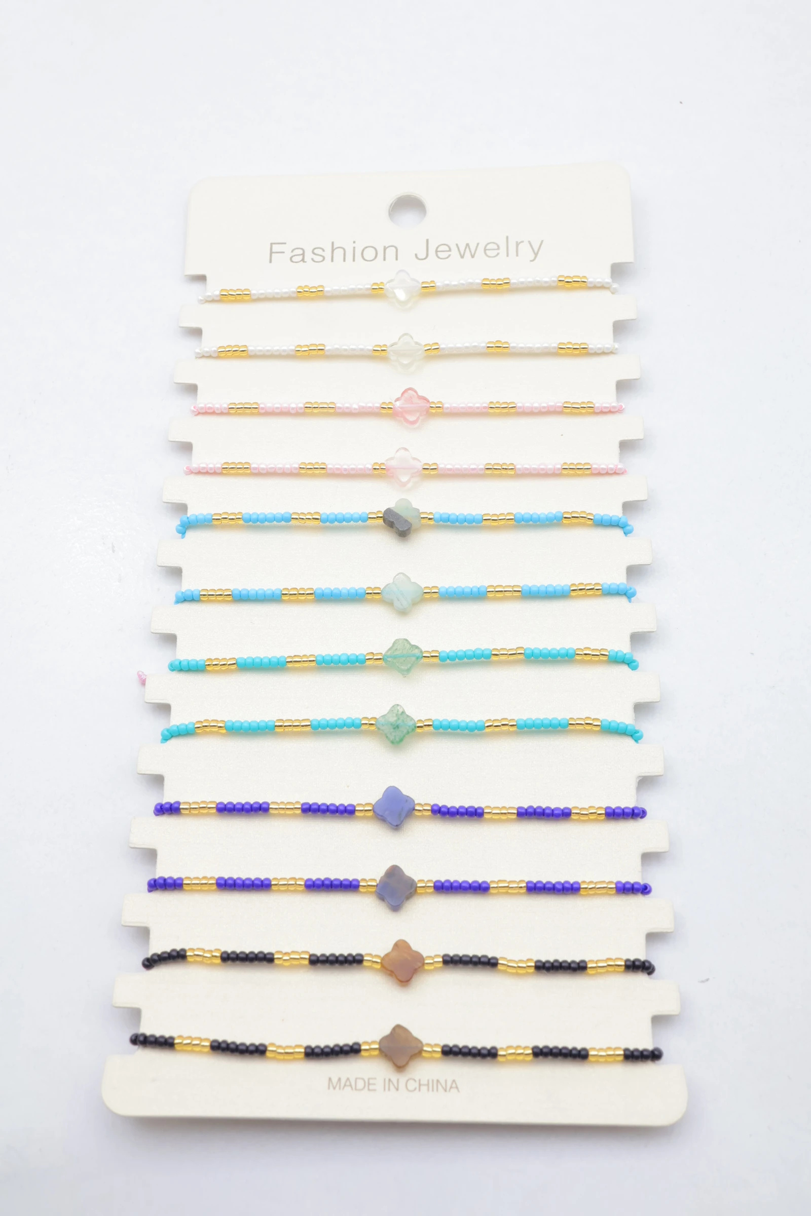 Grossiste Bijoux Mystères - Lot de 12 bracelets coquillages