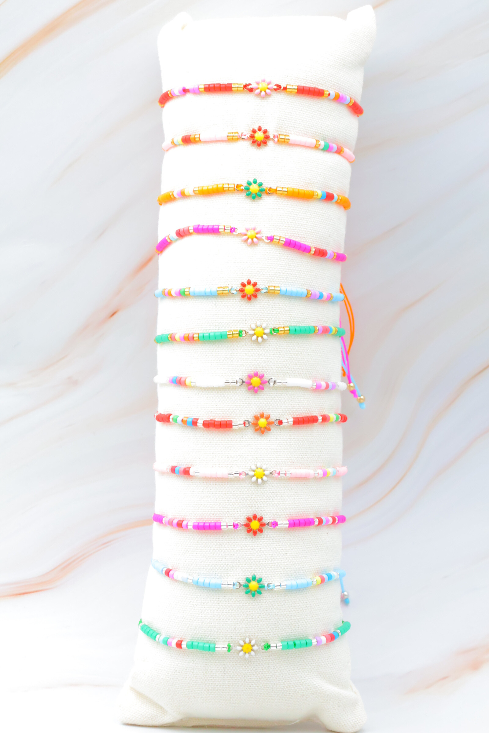 Grossista Bijoux Mystères - Set di 12 bracciali in acciaio inossidabile con cuscino incluso