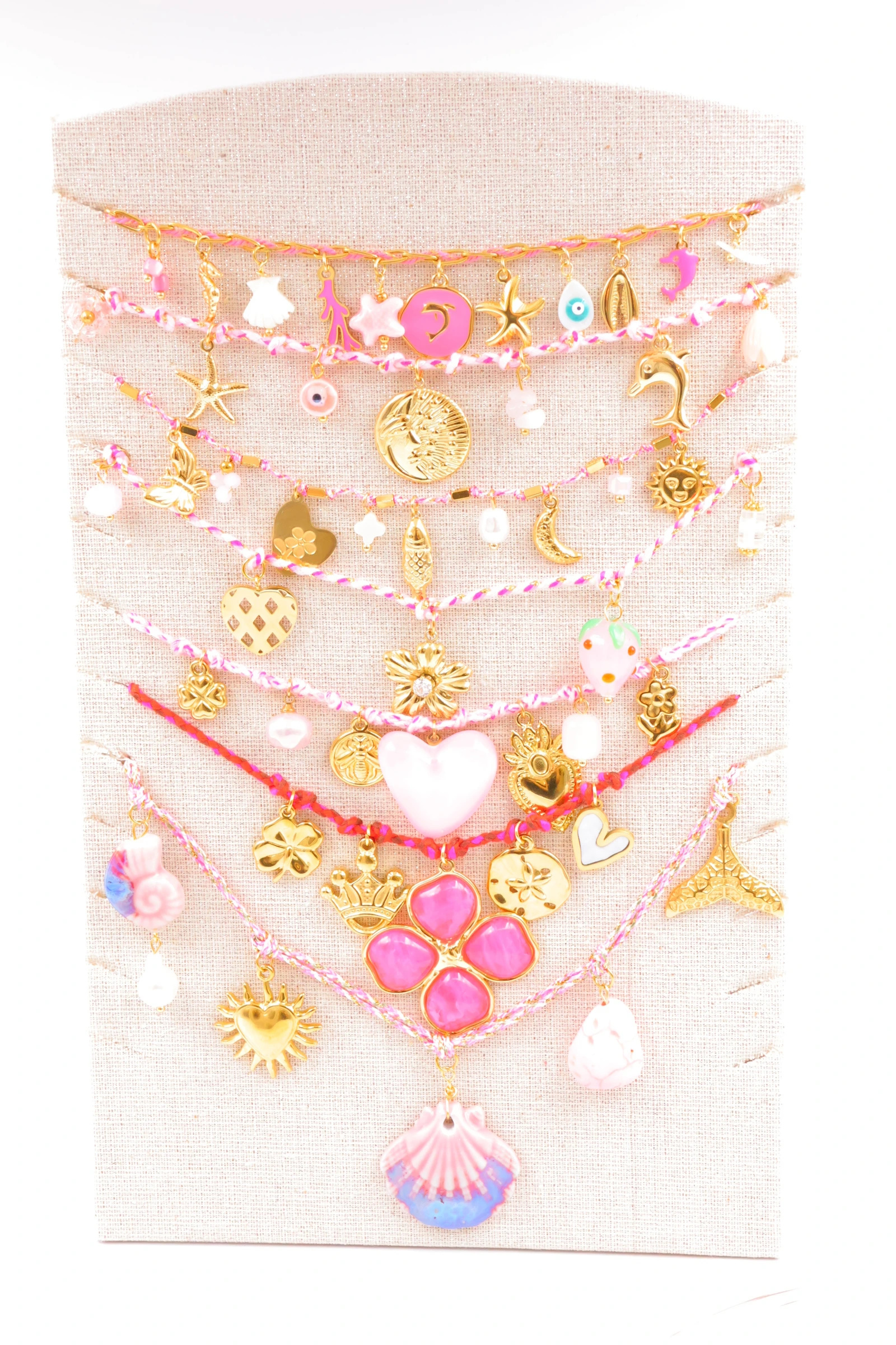 Grossiste Bijoux Mystères - Lot de 7 colliers en acier inoxydable avec présentoir