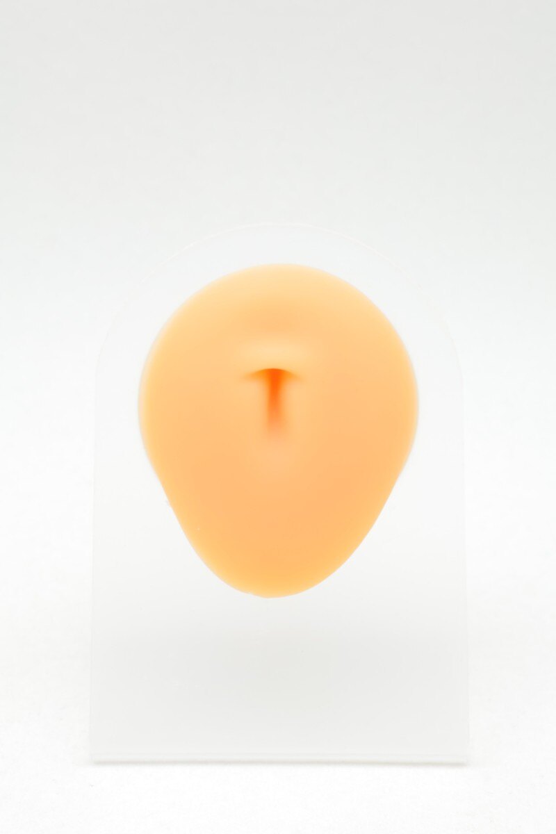 Grossiste Bijoux Mystères - Présentoir nombril en silicone