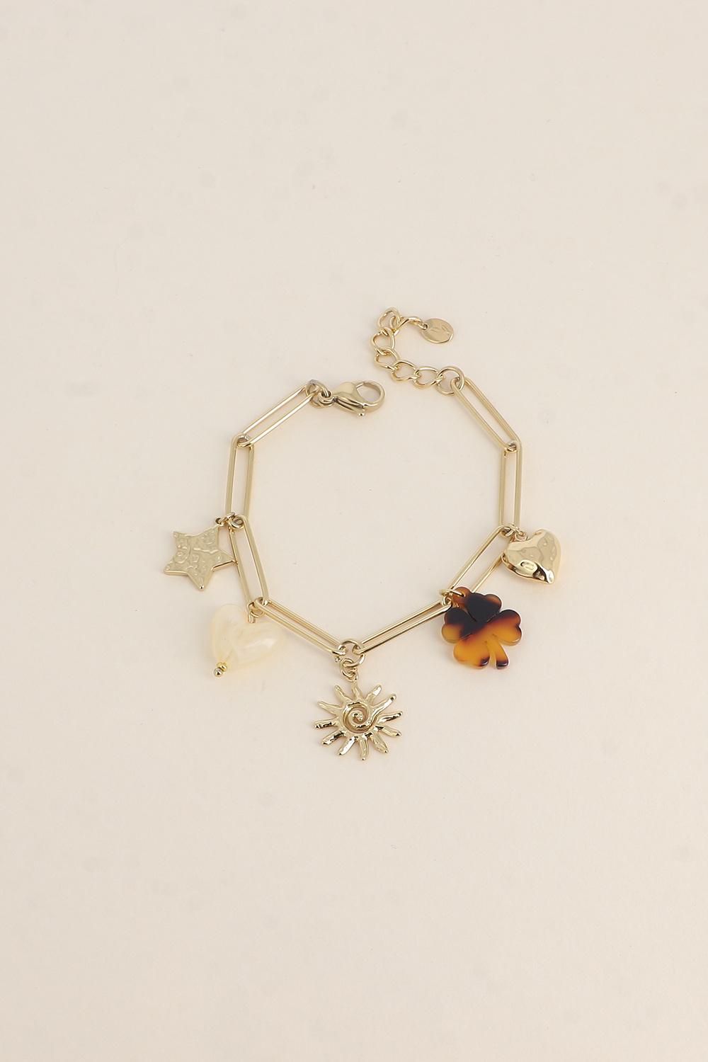 Großhändler Bohm - Armband - gehämmerter Stern, Harzherz und Kleeblatt, wirbelnde Sonne, gehämmertes Herz