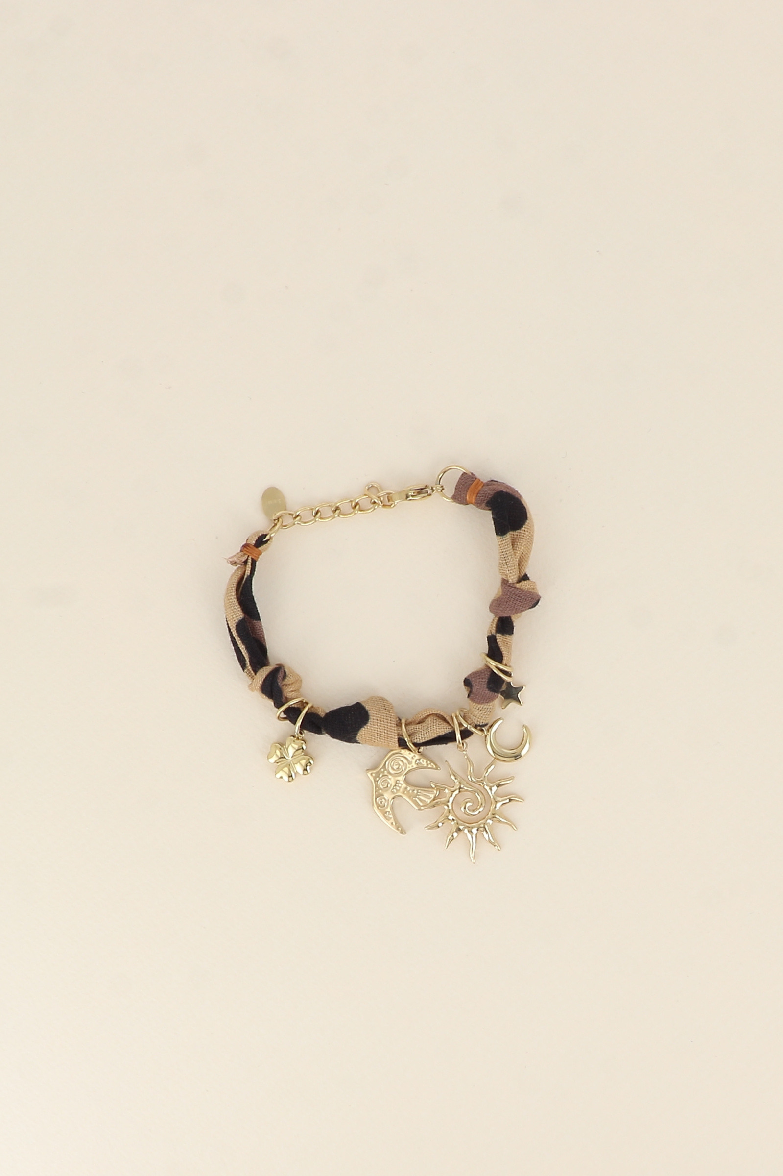 Mayorista Bohm - Pulsera - cinta, tela y dijes (sol, pájaro, luna, estrella, trébol)