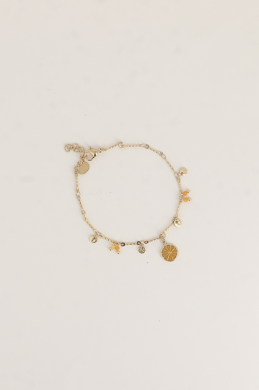 Grossiste Bohm - Bracelet - pastilles rondes martelées, pierres naturelles et pendentif rondelle d'orange