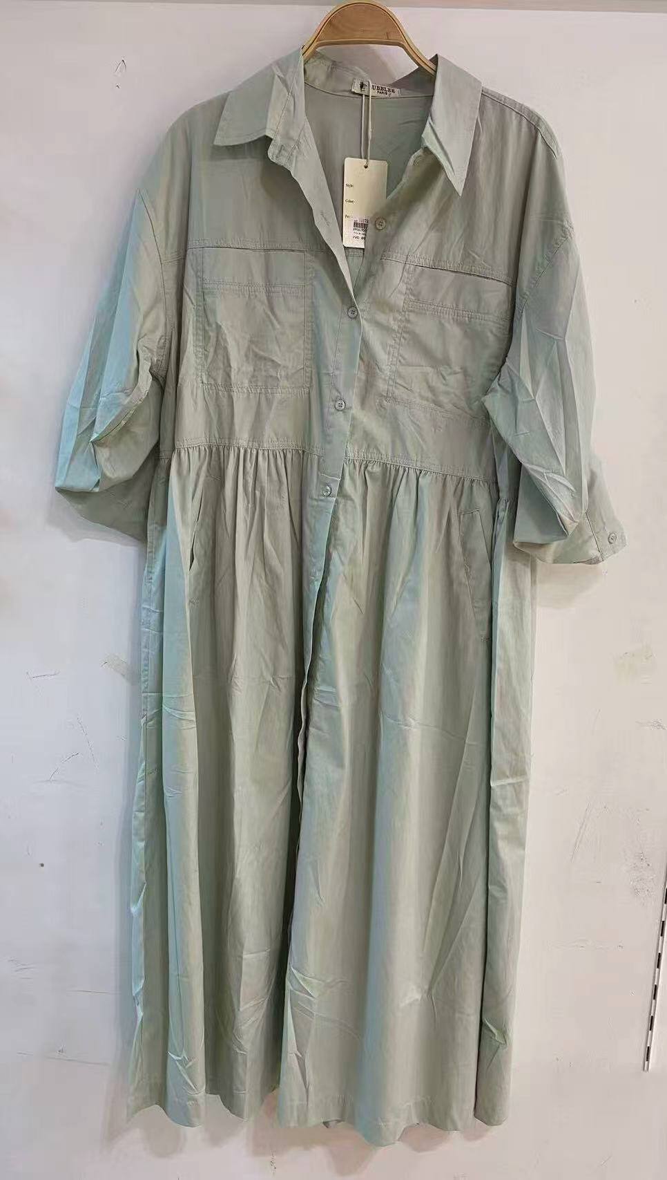 Dress with square pocket and topstitching.