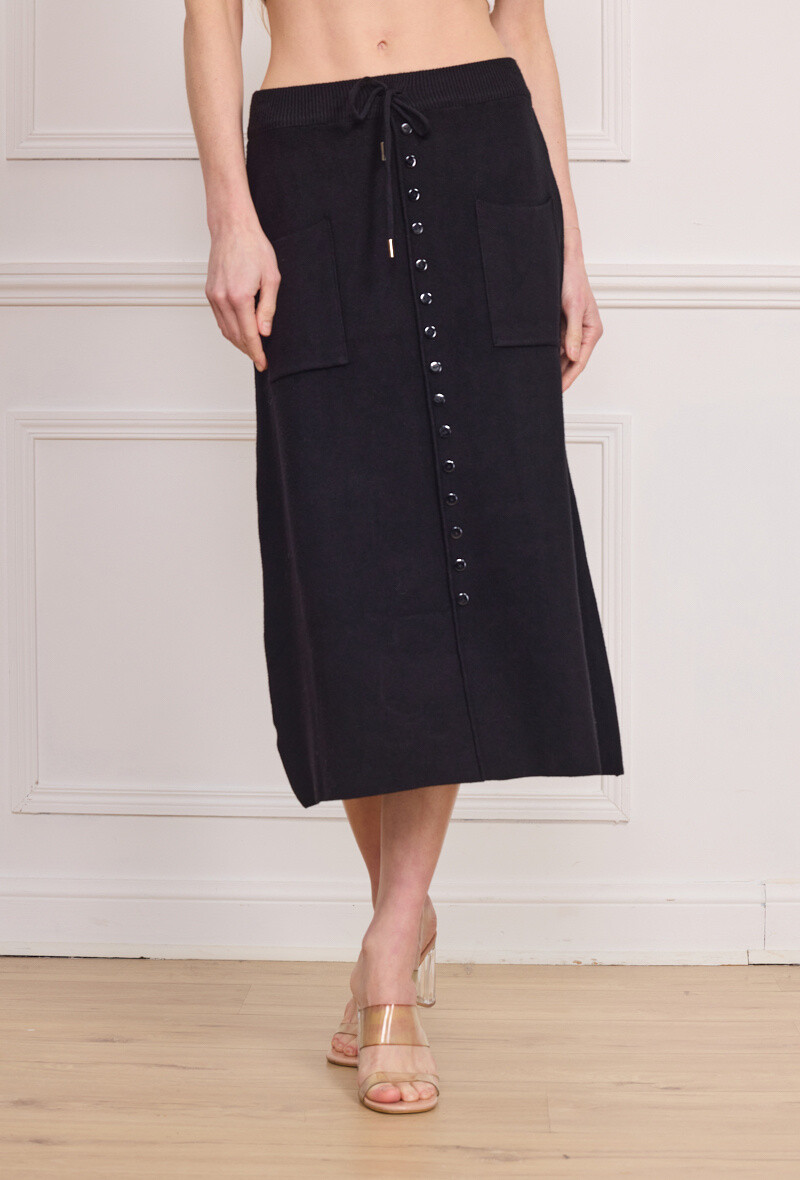 Grossista By Clara - Gonna in maglia nera chic con orlo pieghevole e bottoni dorati