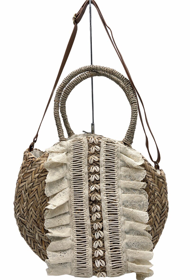 Mayorista By Oceane - Bolso redondo de paja decorado con flecos negros y conchas pequeñas
