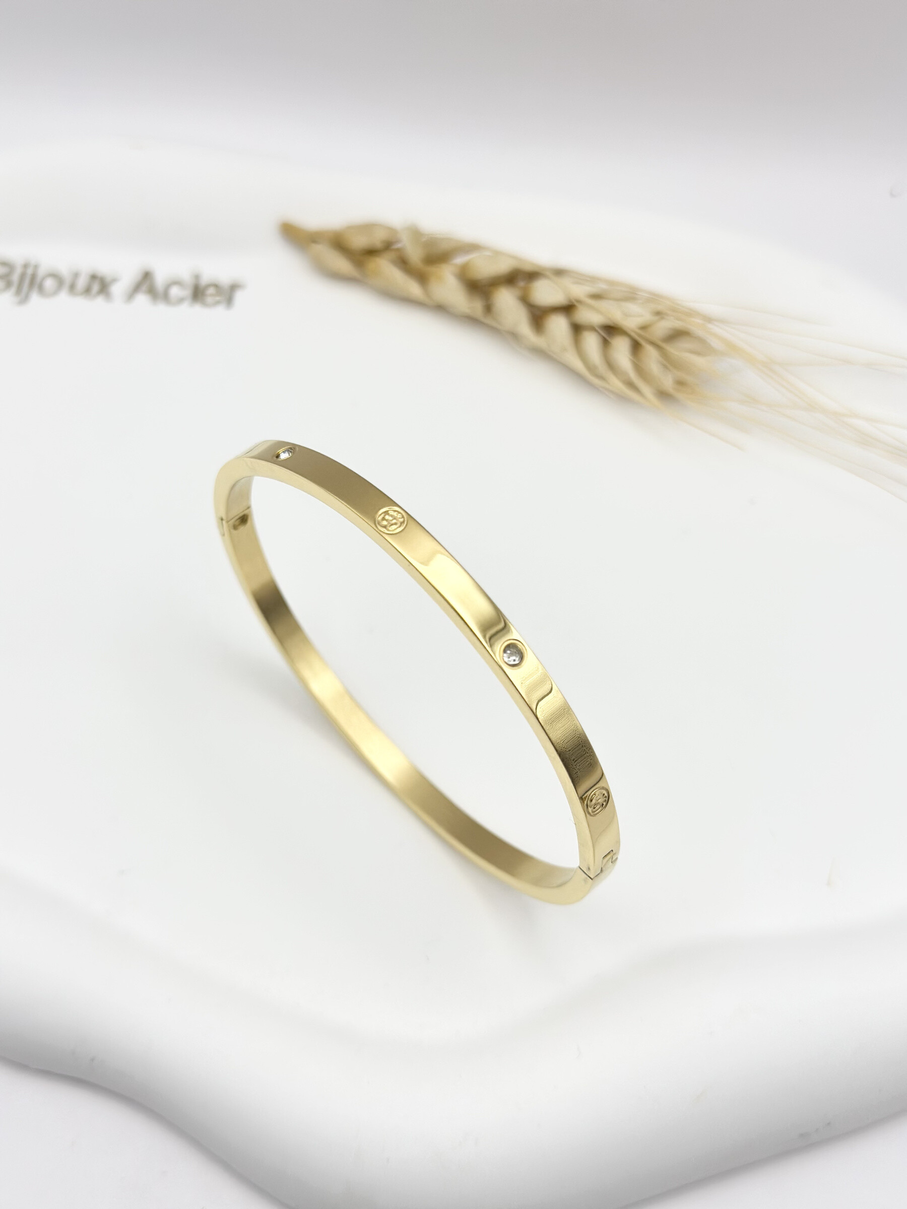 Grossiste Ceramik - Bracelet rigide "Om"  Acier inoxydable doré ou argenté avec strass 4mm