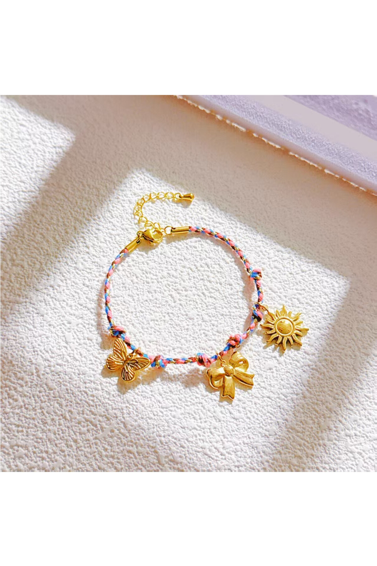 Grossista Ceramik - Bracciale cordino multicolore con ciondoli Acciaio inossidabile