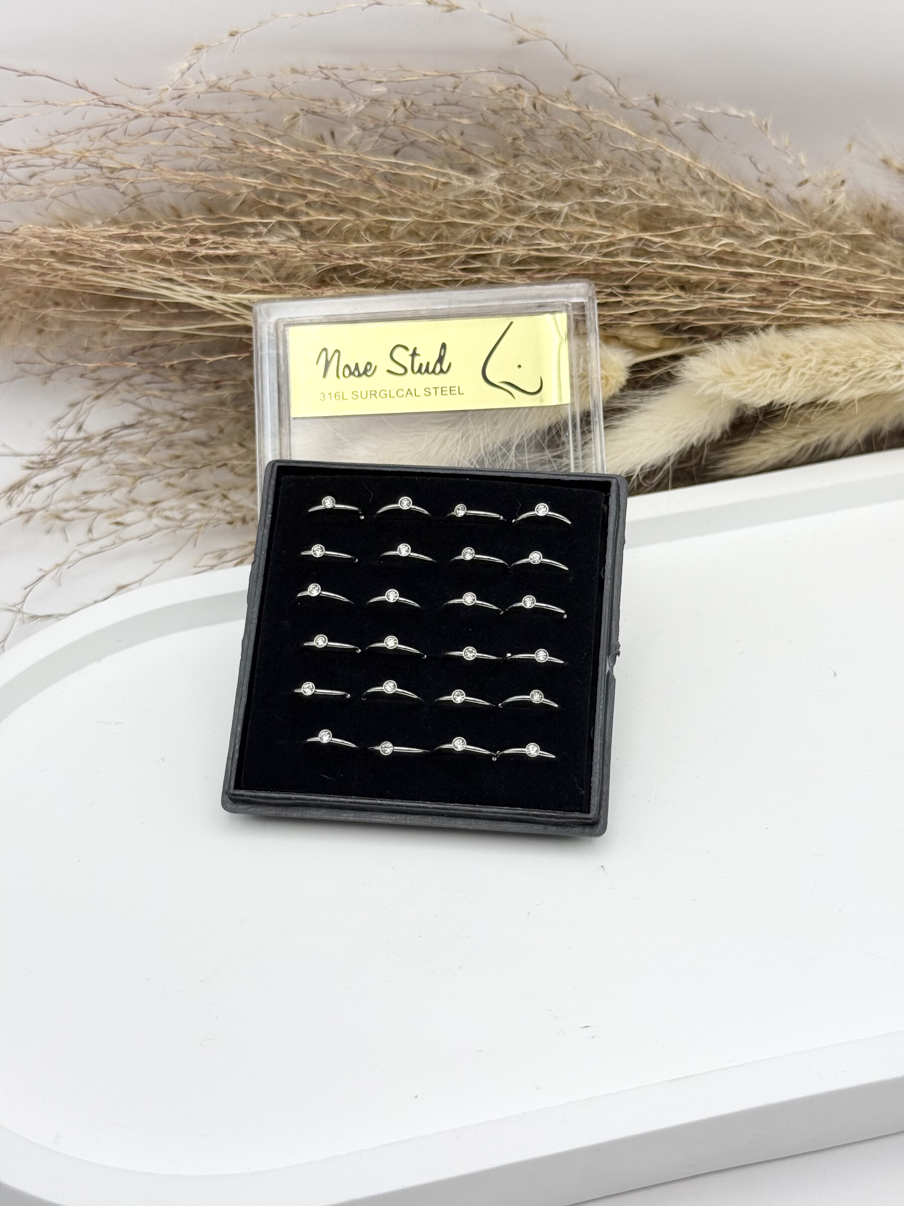 Grossiste Ceramik - Boîte de 24 Piercings de Nez Acier Inoxydable, anneau 9mm stras