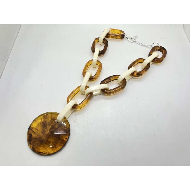 Grossiste CLEDOR - Collier bicolore composé de grands maillons et un pendentif rond.