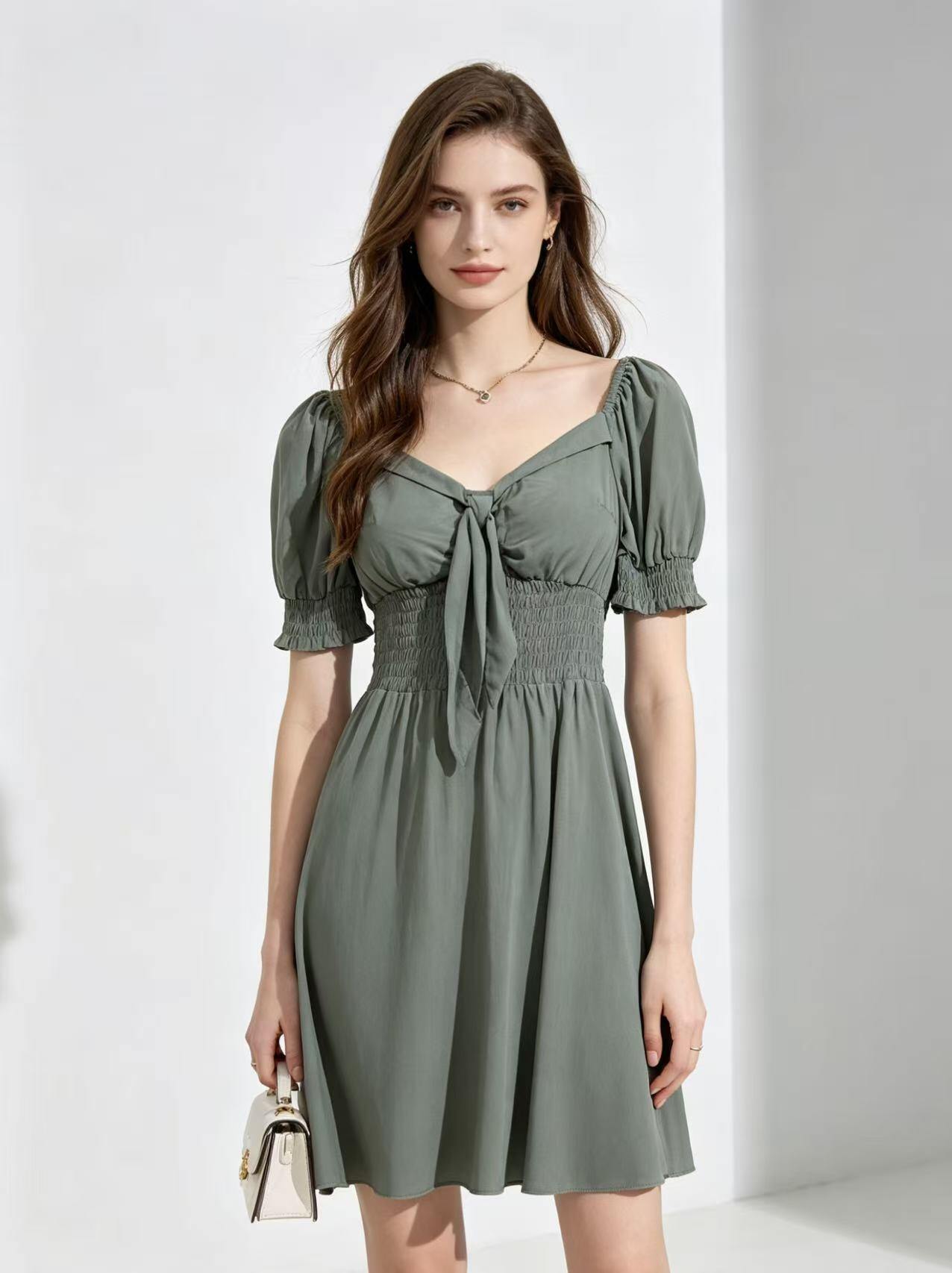 Grossista CM MODE - Abito midi con bustier a fiocco e maniche a sbuffo, disponibile in vari colori a tinta unita