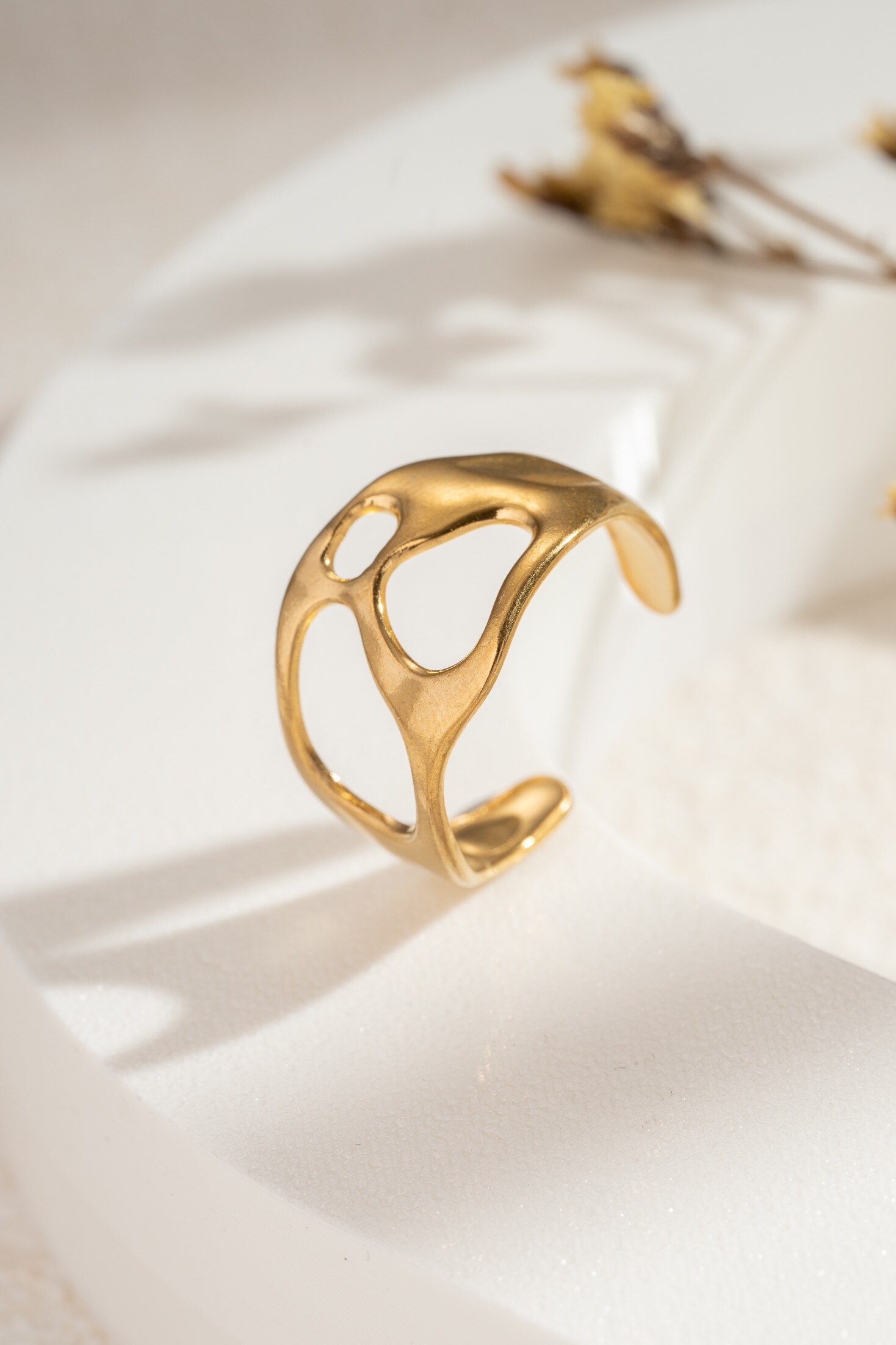 Wholesaler COSMOS - Adjustable openwork organic gold-plated steel ring for women, sculptural, modern, elegant, and durable