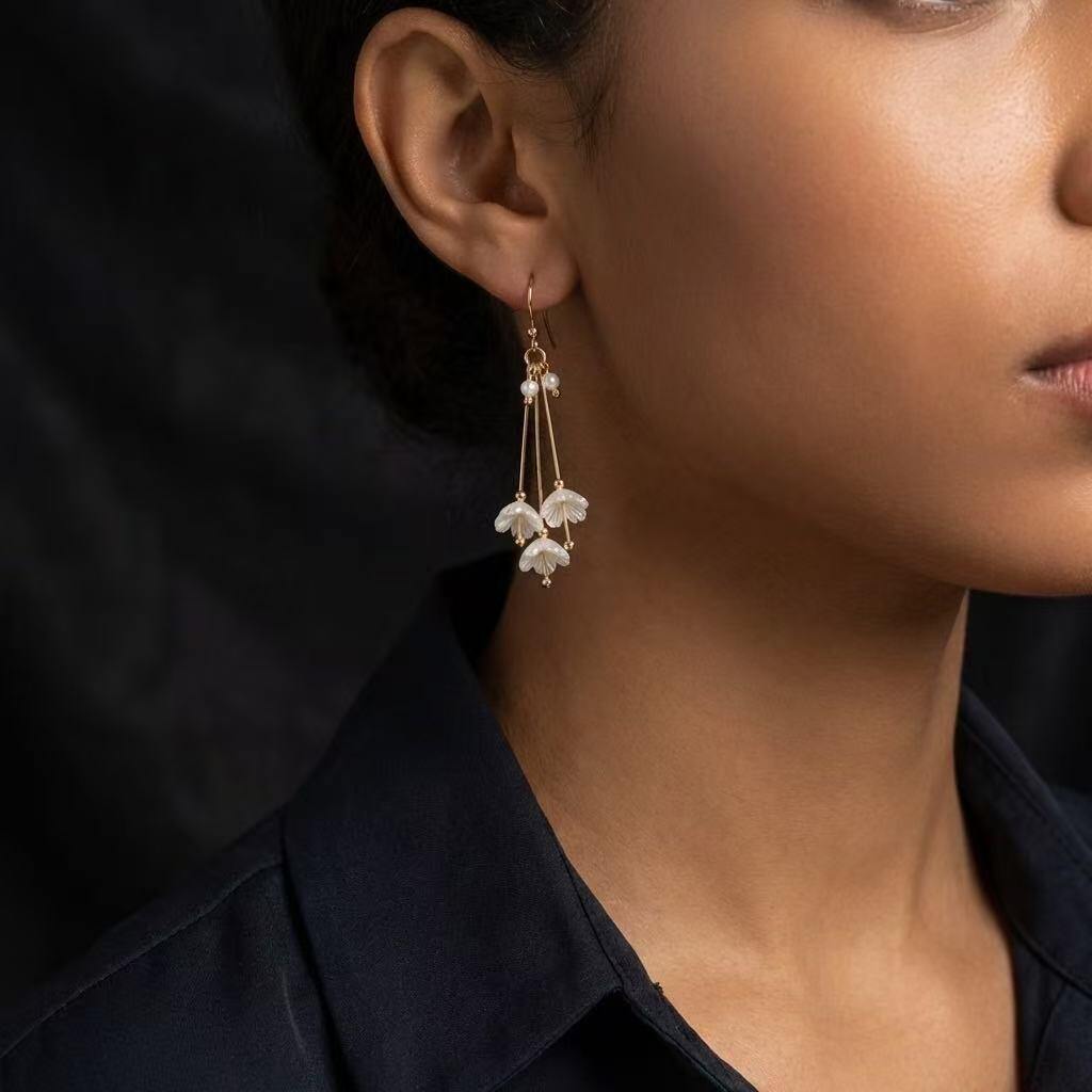 Wholesaler COSMOS - Golden flower earrings with long tassels and elegant pearls, trendy stainless steel