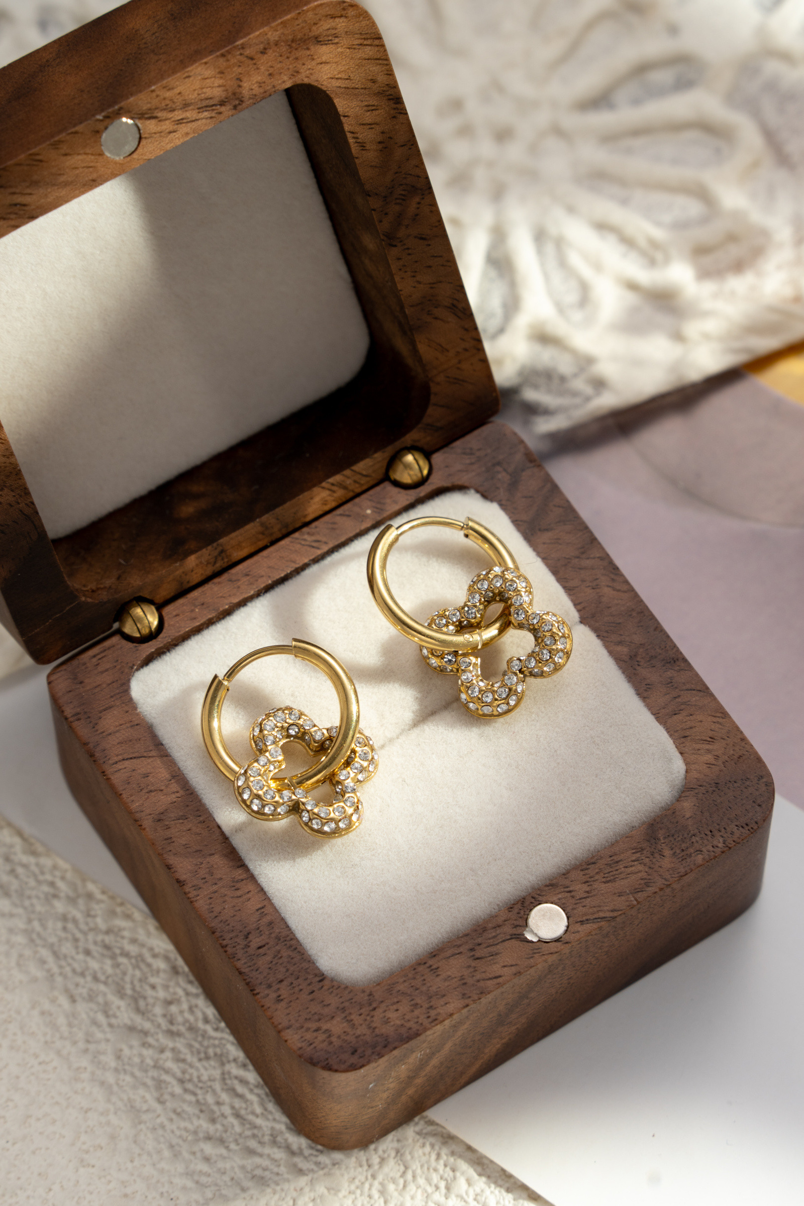 Wholesaler COSMOS - Stainless steel hoop earrings with clover design, paved with golden zirconia, elegant, shiny, and trendy