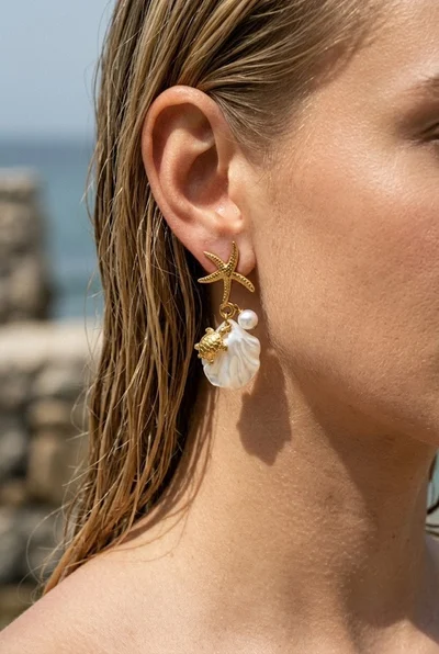 Grossiste COSMOS - Boucles étoile mer tortue dorées acier inoxydable perle coquillage nacré élégantes Grossiste COSMOS - Boucles étoile mer tortue dorées acier inoxydable perle coquillage nacré élégantes