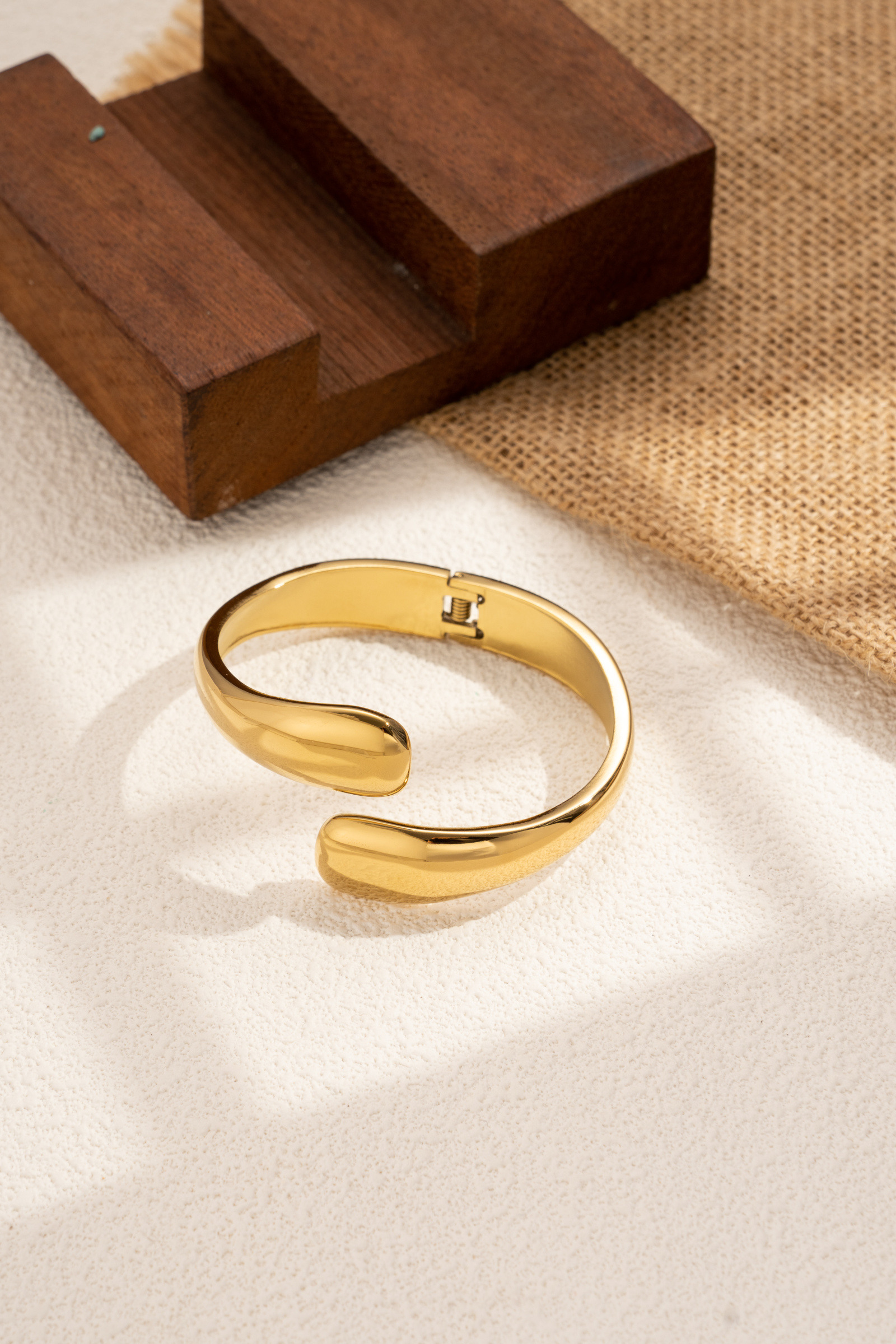 Wholesaler COSMOS - Women's sculptural bangle bracelet in gold stainless steel, modern, elegant, minimalist, refined