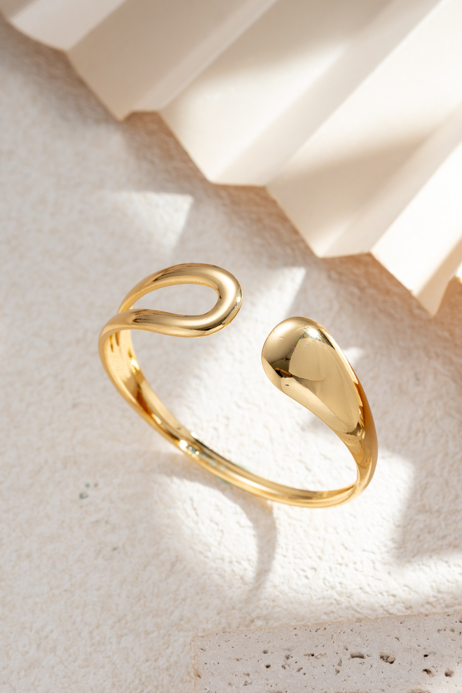 Wholesaler COSMOS - Open gold bracelet with sculptural drops, modern minimalist chic, elegant and trendy