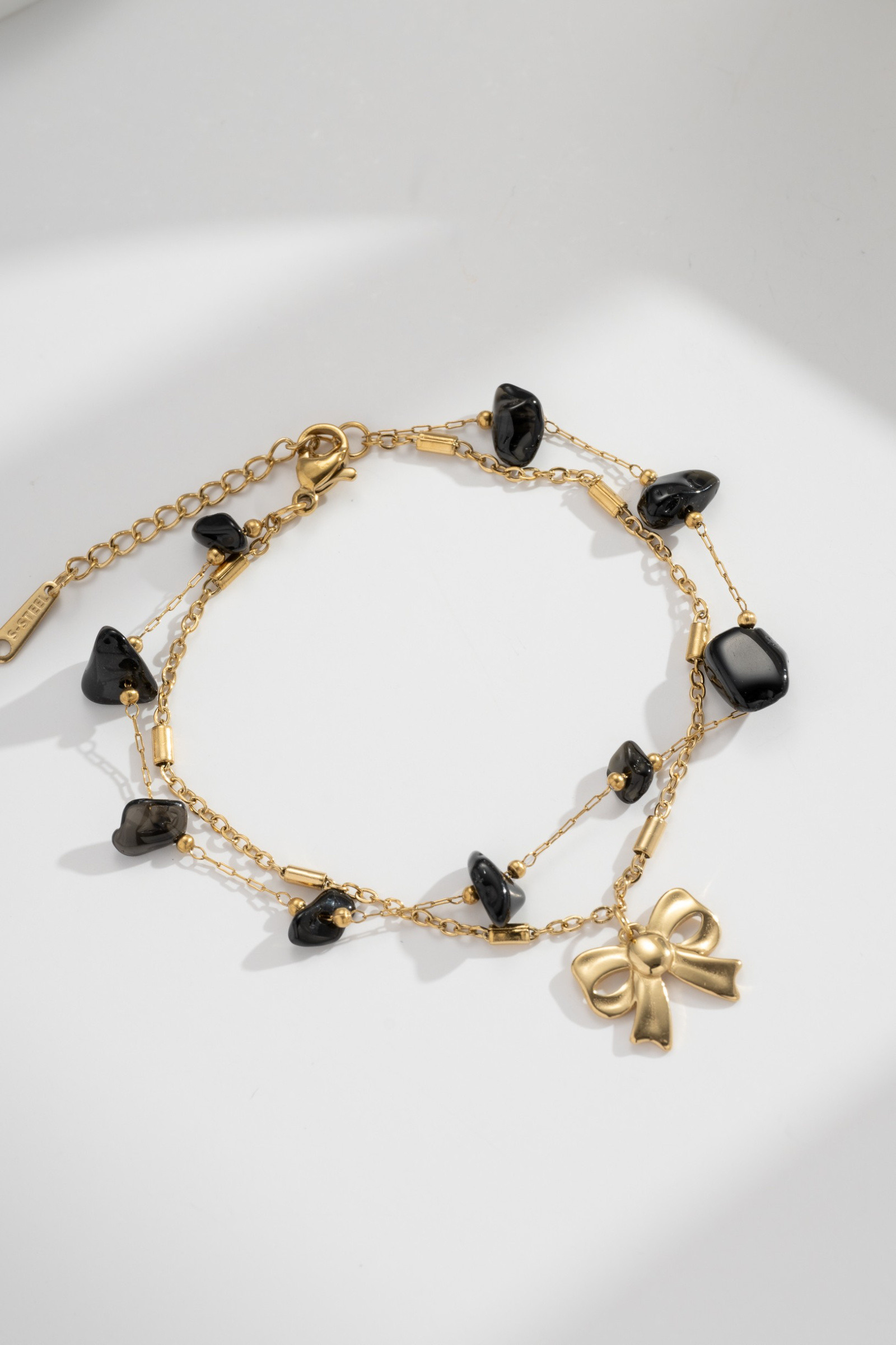 Wholesaler COSMOS - Double Chain Gold-Plated Stainless Steel Bracelet with Black Stones Knot Feminine Timeless Chic
