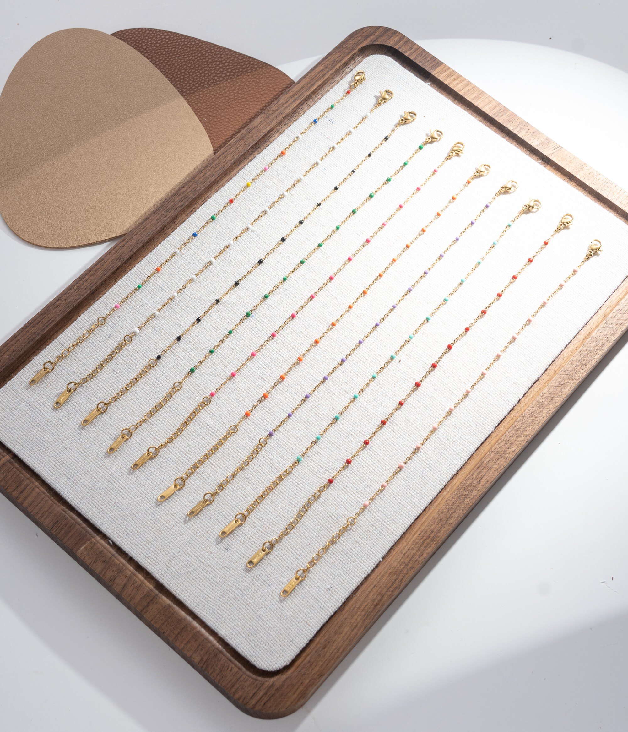 Wholesaler COSMOS - Set of 10 gold bracelets with fine colorful beads for women, elegant and trendy for summer