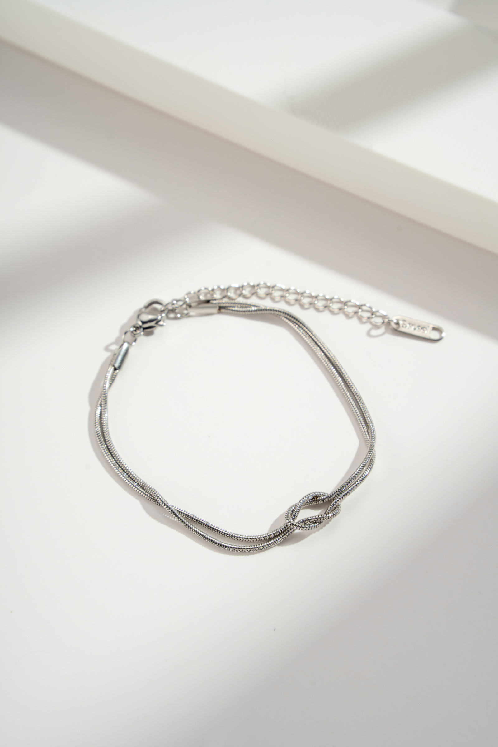 Grossiste COSMOS - Bracelet nœud acier inoxydable, chaînette fine élégante doré argenté moderne